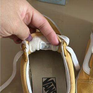 Size 7 yellow Vans shoes.